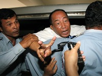Supporters of Mam Sonando (shown here Monday after his conviction) say the pro-democracy activist drew the government's ire by trying to help farmers in eastern Kratie province protect their land. He also runs one of the few private broadcasters in the country that is critical of the government.