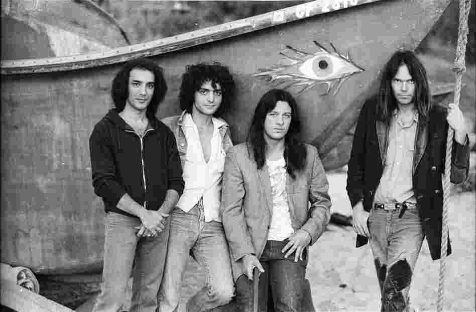 With Crazy Horse, left to right: Ralph Molina, Billy Talbot, Frank "Poncho" Sampedro, Neil Young. On Malibu Beach, 1975.