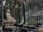 A statue of Lord Buddha is left standing amidst the torched ruins of the Lal Ching Buddhist temple at Ramu, Bangladesh. Thousands of rioters torched Buddhist temples and homes in southeastern Bangladesh Sunday over a photo posted on Facebook deemed offensive to Islam, in a rare attack against the community. A statue of Lord Buddha is left standing amidst the torched ruins of the Lal Ching Buddhist temple at Ramu, Bangladesh. Thousands of rioters torched Buddhist temples and homes in southeastern Bangladesh Sunday over a photo posted on Facebook deemed offensive to Islam, in a rare attack against the community.