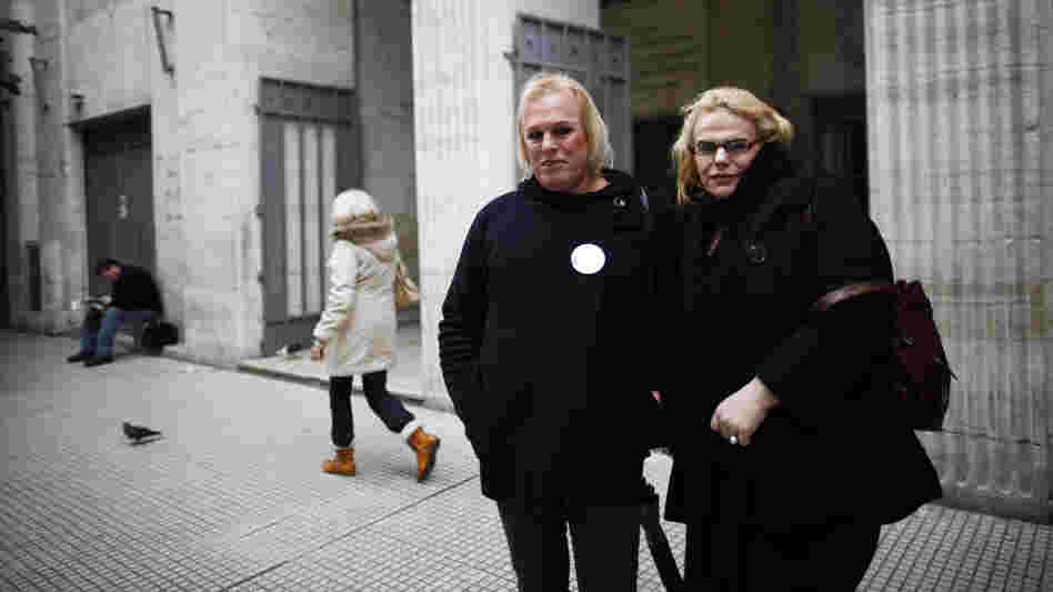 Transsexuals Maiamar Abrodos (right) and Maria Laura Aleman arrive at the civil registry to begin the legal process to change their genders in Buenos Aires, Argentina, in June. Transsexuals Maiamar Abrodos (right) and Maria Laura Aleman arrive at the civil registry to begin the legal process to change their genders in Buenos Aires, Argentina, in June.