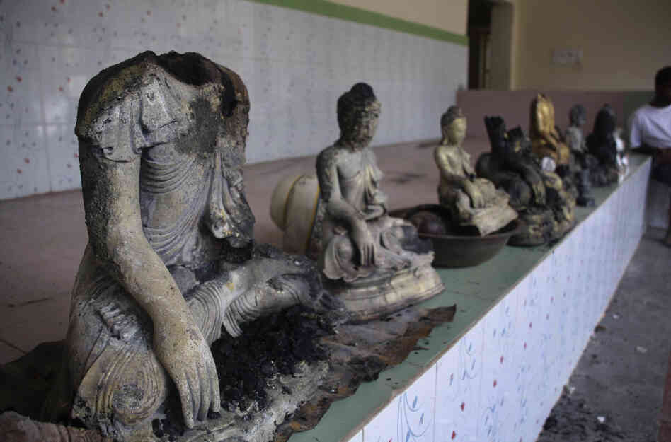 Damaged statues at a Buddhist temple that was torched in Ramu in the coastal district of Cox's Bazar, Bangladesh.