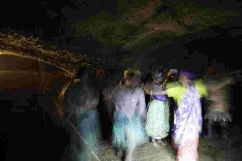 This sacred cave housed the Batwa king and was the main venue for celebrations. A choir in the darkness sings a song of sadness about how the Batwa were driven from the forest, and how much they miss it.