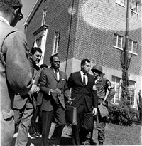 Meredith, center with briefcase, is escorted to the University of Mississippi campus by U.S. marshals on Oct. 1, 1962.
