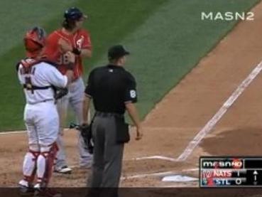 Michael Morse (in red) pretends to swing again before going on another home run trot.