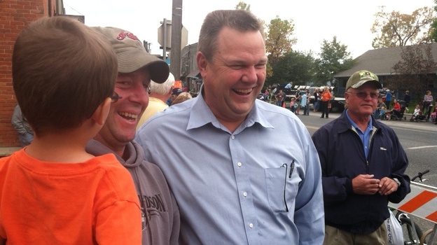 Sen. Jon Tester, D-Mont., (center) campaigns at a parade Saturday in Belgrade, Mont.