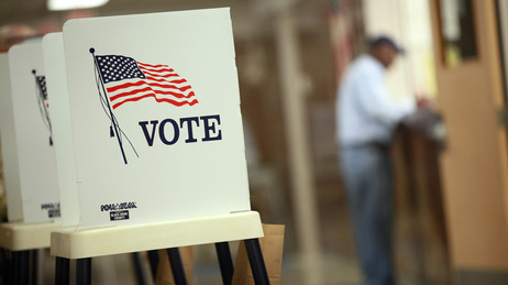 Early voting has begun in the battleground states of Ohio, Virginia and Iowa. Voting booths are set up for early voting at the Black Hawk County Courthouse last Thursday in Waterloo, Iowa. On the eve of Wednesday's first presidential debate, an NPR poll finds President Obama with a 7-point lead nationally, but his GOP challenger, Mitt Romney, is within striking distance.