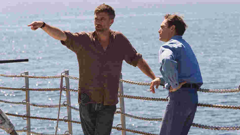 Paul Thomas Anderson (left) works with actor Joaquin Phoenix on the set of The Master. Paul Thomas Anderson (left) works with actor Joaquin Phoenix on the set of The Master.