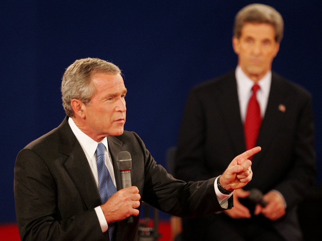 In a 2004 debate in St. Louis, President Bush answers a question as his opponent, Sen. John Kerry, listens. Both candidates used a number of "pivots" in their debates.