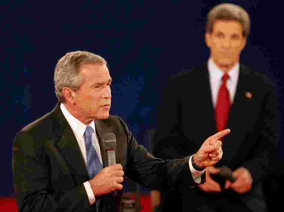 In a 2004 debate in St. Louis, President Bush answers a question as his opponent, Sen. John Kerry, listens. Both candidates used a number of "pivots" in their debates.