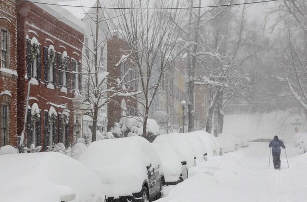 A person uses cross country skis to get up 26th Street NW near P Street in the snow in Washington in 2010.