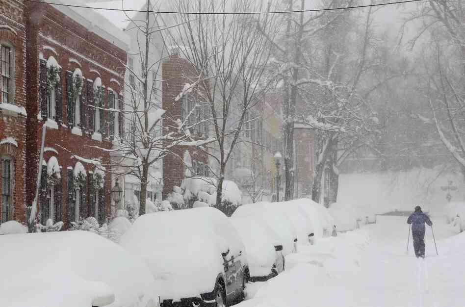 A person uses cross country skis to get up 26th Street NW near P Street in the snow in Washington in 2010.