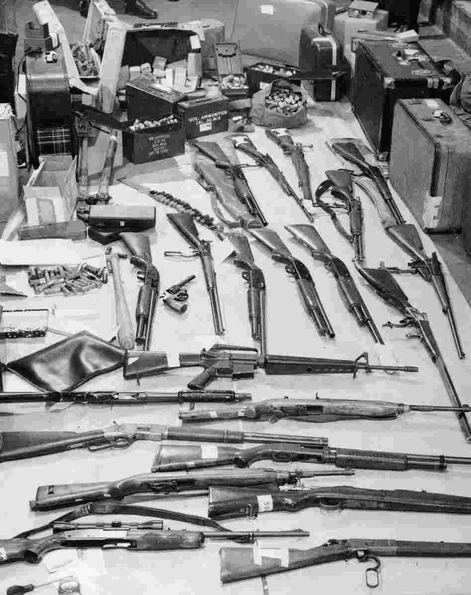 Police display guns and ammunition seized by officers on April 16, 1974, when 14 Black Panther Party members were arrested at the party's precinct headquarters. Bobby Seale called the raid a plot to discredit them, timed to hurt the organization's chances of winning a majority of seats in next year's City Council.
