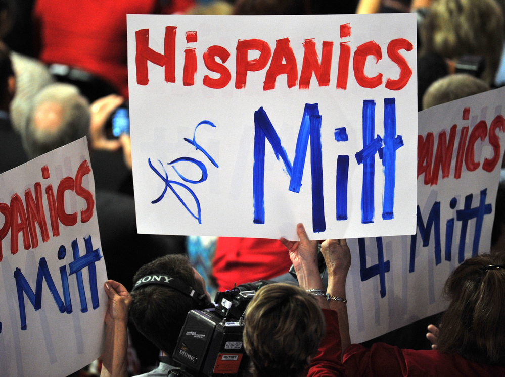 Delegates wave banners during Mitt Romney's acceptance speech at the Republican National Convention in August.