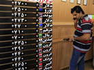 An Iranian man checks the rates of foreign currencies at a currency exchange bureau in central Tehran on Sept. 29. The Iranian currency lost nearly one-third of its value in a day over the weekend. An Iranian man checks the rates of foreign currencies at a currency exchange bureau in central Tehran on Sept. 29. The Iranian currency lost nearly one-third of its value in a day over the weekend.