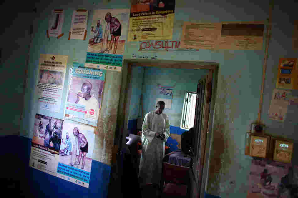 A local health official stands in the consultation room of a health clinic and hospital in Bagega, Nigeria. At first, miners in the region were processing lead-laden gold ore inside their homes. Doctors Without Borders persuaded most of them to move the processing to the outskirts of town.