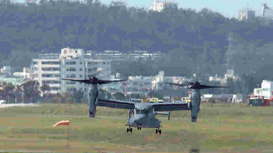 An Osprey arrives at U.S. Marine Corps Air Station Futenma in Ginowan city on Japan's southern island of Okinawa on Monday. Six Ospreys were deployed in Okinawa, drawing sharp reactions from residents amid persistent concerns about the aircraft's safety.