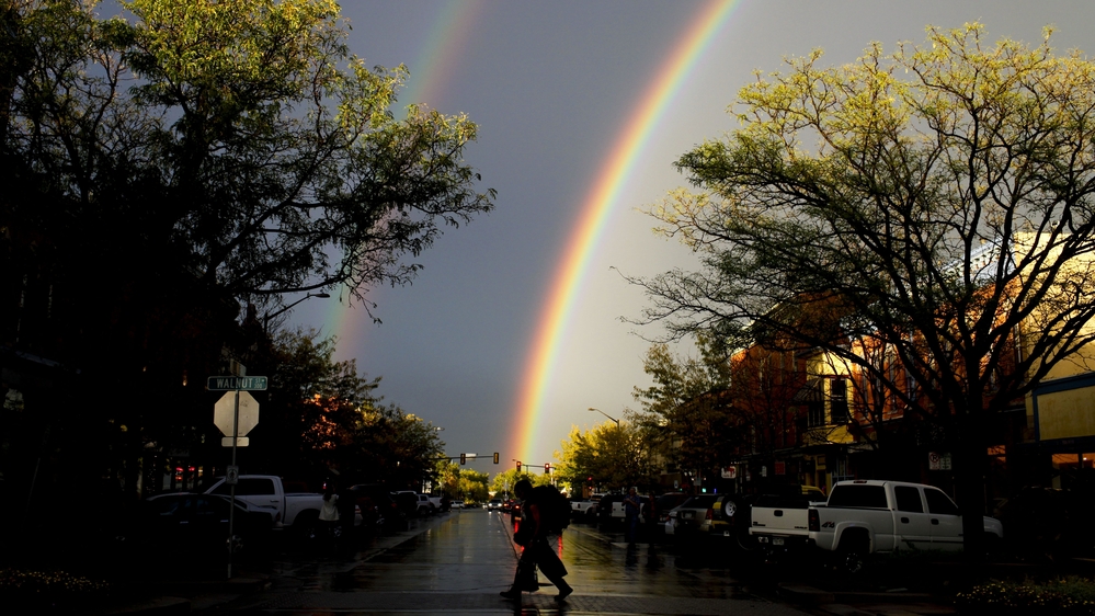 A rare thunderstorm produced hail, torrential rain and a double rainbow in downtown Fort Collins, Colo., last month.
