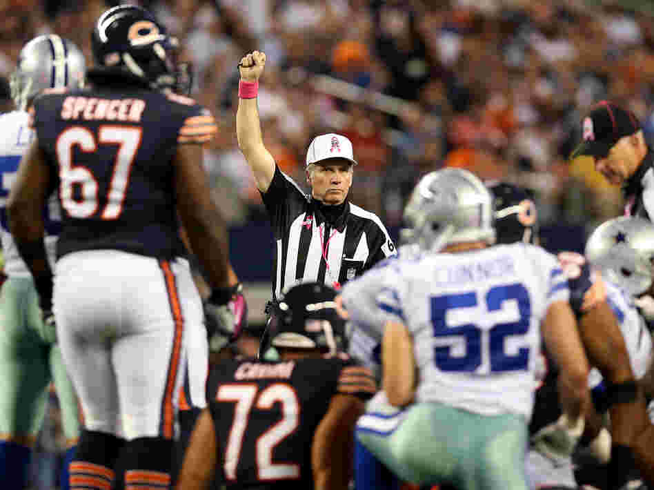 Referee Walt Anderson makes a call in the Chicago Bears game against the Dallas Cowboys Monday, ending the NFL's first full slate of games with its regular officials.