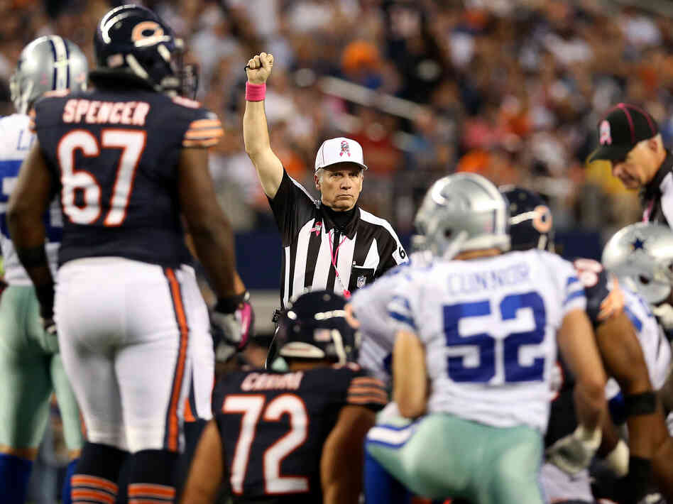 Referee Walt Anderson makes a call in the Chicago Bears game against the Dallas Cowboys Monday, ending the NFL's first full slate of games with its regular officials.
