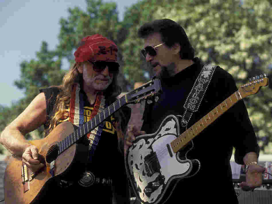 Willie Nelson (left) and Waylon Jennings, members of the country supergroup The Highwaymen, perform at a concert in Central Park in 1993.