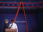 University student Dia Mohamed gets a wireless microphone put on his tie as he stands in for President Barack Obama during rehearsal for the first presidential debate in the Ritchie Center at the University of Denver on Tuesday. University student Dia Mohamed gets a wireless microphone put on his tie as he stands in for President Barack Obama during rehearsal for the first presidential debate in the Ritchie Center at the University of Denver on Tuesday.