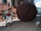 Janet Whitley borrows a stranger's dog to run away from a 10-foot-high plastic boulder in Washington, D.C.'s "Alley of Doom." Janet Whitley borrows a stranger's dog to run away from a 10-foot-high plastic boulder in Washington, D.C.'s "Alley of Doom."
