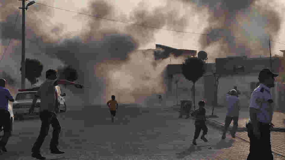Smoke rises after artillery fire  from nearby Syria hits the Turkish border town of  Akcakale. Turkey said five of its citizens were killed and that it responded by firing on targets in northern Syria. The episode raised tensions on the already volatile border region.