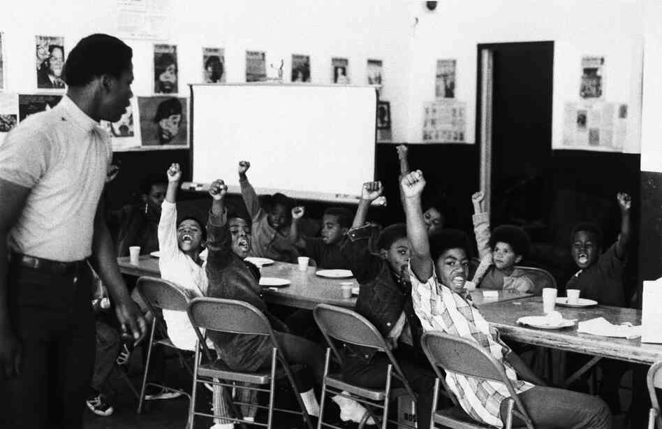 The Panthers also ran a number of social service programs in cities across the country, including free breakfasts for students, health clinics and schools. Here, students give the black power salute at a San Francisco Black Panther "liberation school" in 1969.