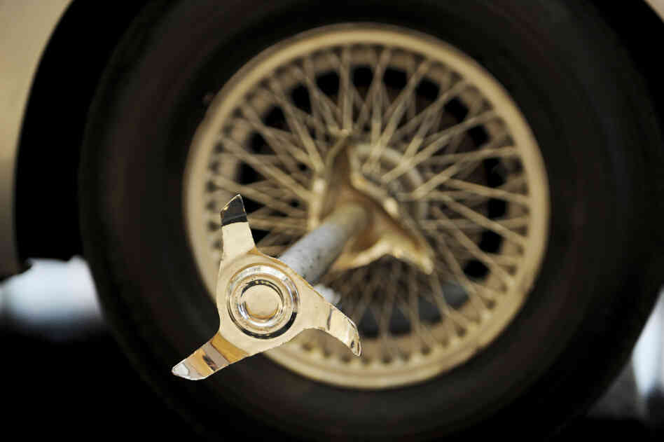 A tire-splitter is attached to the Aston Martin DB5 driven by actor Sean Connery in Goldfinger and Thunderball, part of a 2010 auction at Sotheby's in New York.