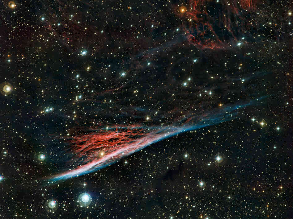 Just the tiniest slice of what's out there: the Pencil Nebula is pictured in an image from the European Southern Observatory's La Silla facility in Chile. This peculiar cloud of glowing gas is part of a huge ring of wreckage left over after a supernova explosion that took place about 11,000 years ago. Just the tiniest slice of what's out there: the Pencil Nebula is pictured in an image from the European Southern Observatory's La Silla facility in Chile. This peculiar cloud of glowing gas is part of a huge ring of wreckage left over after a supernova explosion that took place about 11,000 years ago.