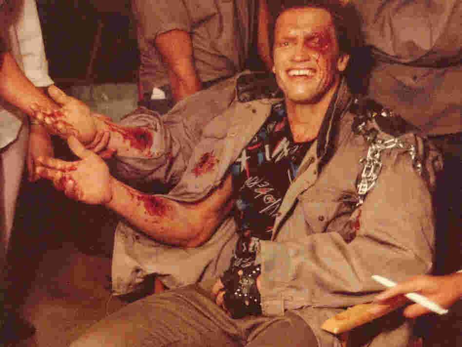 Arnold Schwarzenegger in the makeup trailer for Terminator, getting his do-it-yourself forearm.