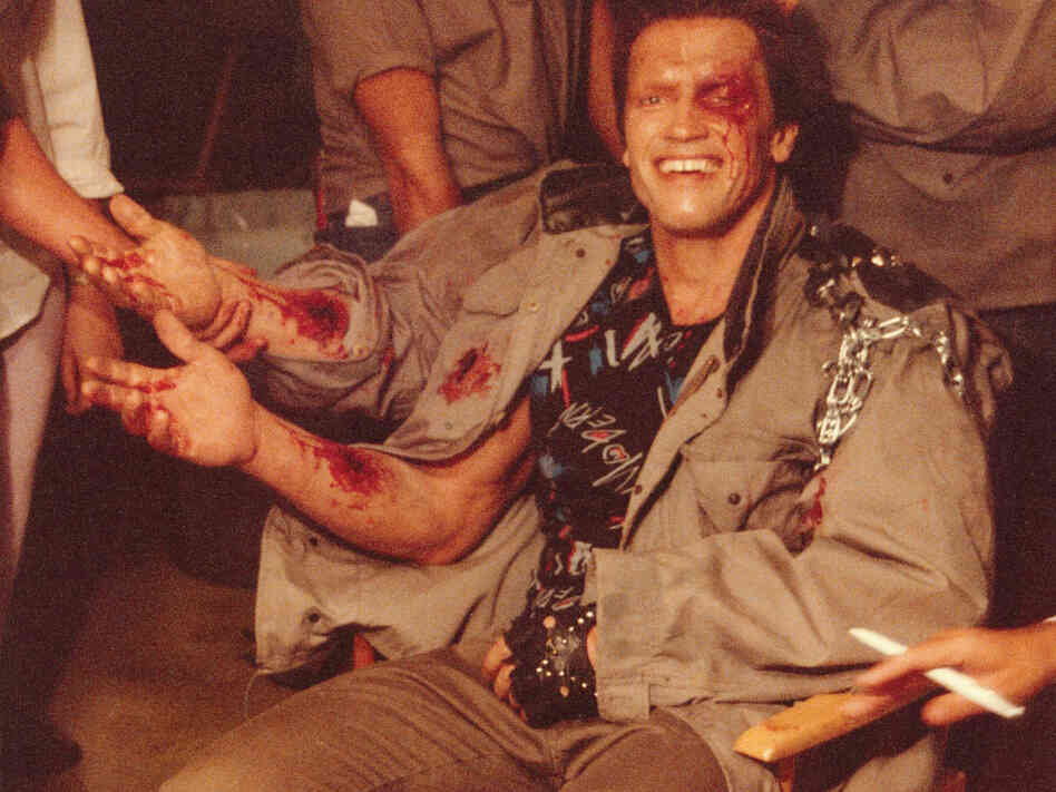 Arnold Schwarzenegger in the makeup trailer for Terminator, getting his do-it-yourself forearm.