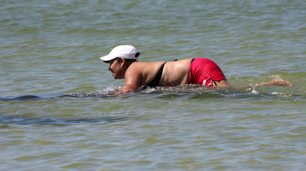Ana Gloria Garcia Gutierrez is seen attempting to ride a manatee.