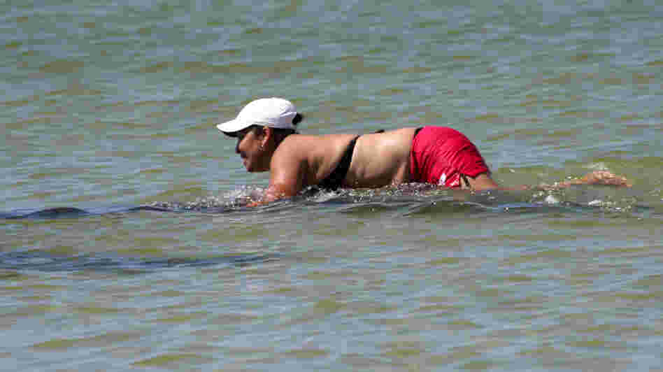 Ana Gloria Garcia Gutierrez is seen attempting to ride a manatee.