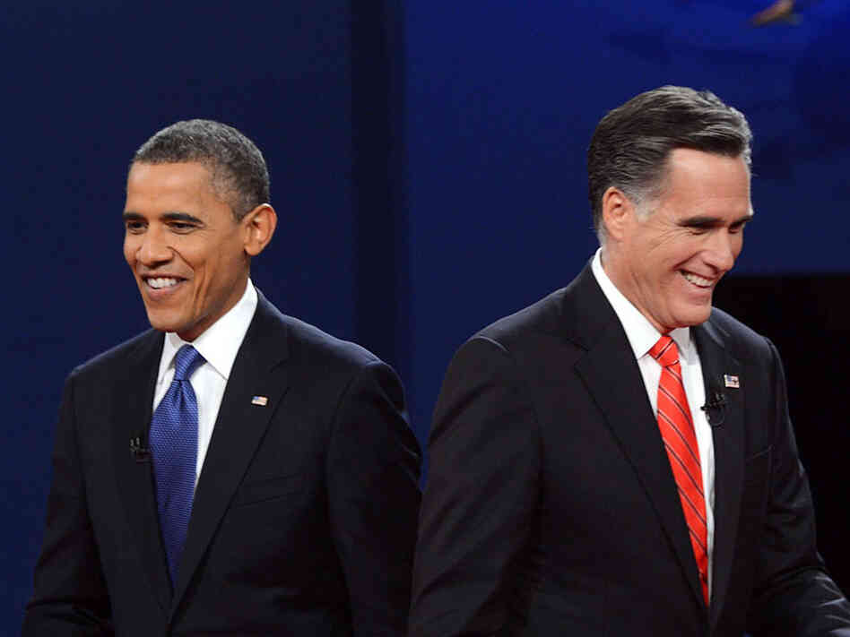 President Obama and Republican presidential candidate Mitt Romney finish their debate at the University of Denver on Wednesday.
