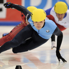 Simon Cho competes in the men's 500-meter finals at the 2011 ISU World Cup short track speedskating final in Dresden, Germany. He won the event.
