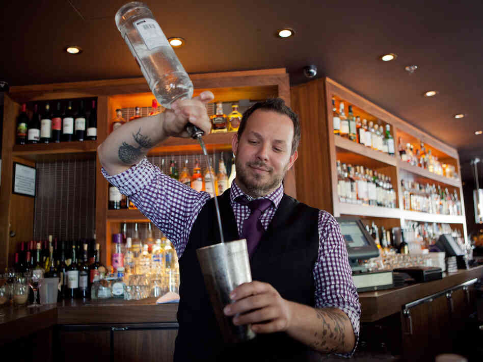 Bar Dupont bartender Brian Collins pours us a cold one.