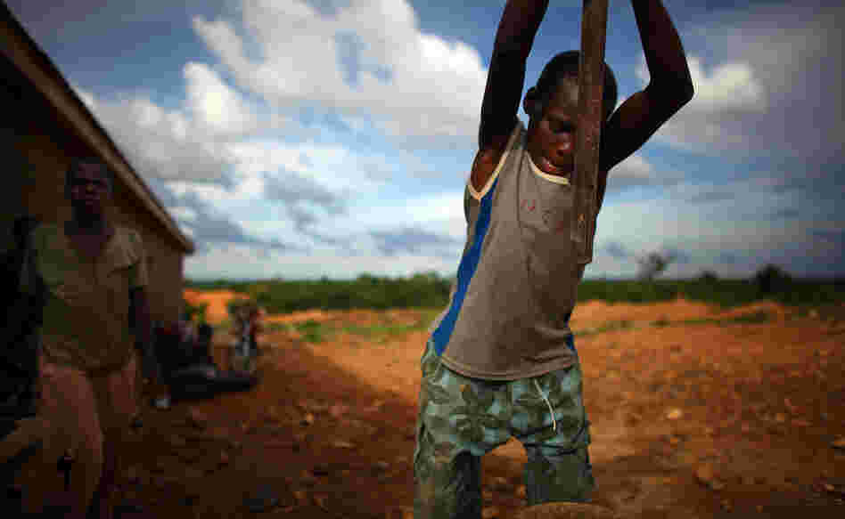 A young boy works at an illegal gold mine in Dareta, Nigeria.