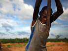 A young boy works at an illegal gold mine in Dareta, Nigeria. A young boy works at an illegal gold mine in Dareta, Nigeria.