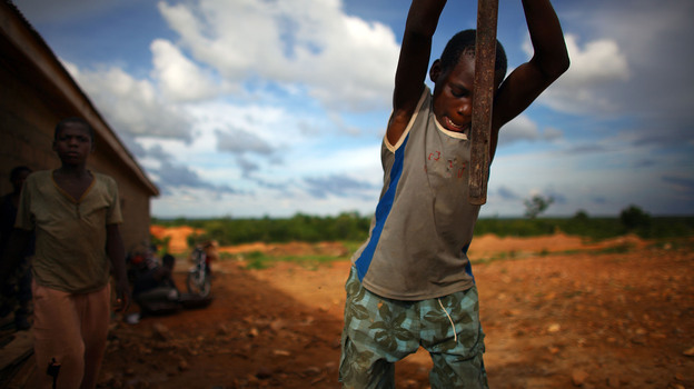 A young boy works at an illegal gold mine in Dareta, Nigeria. (NPR)
