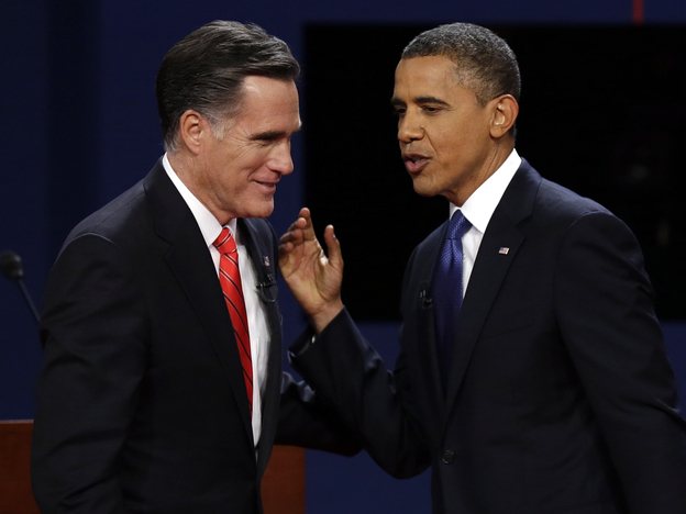 Republican presidential nominee Mitt Romney and President Obama talk after the first presidential debate at the University of Denver on Wednesday.