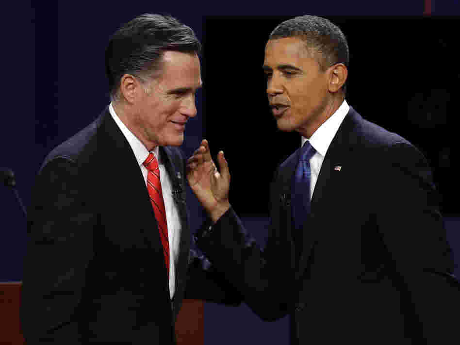 Republican presidential nominee Mitt Romney and President Obama talk after the first presidential debate at the University of Denver on Wednesday.