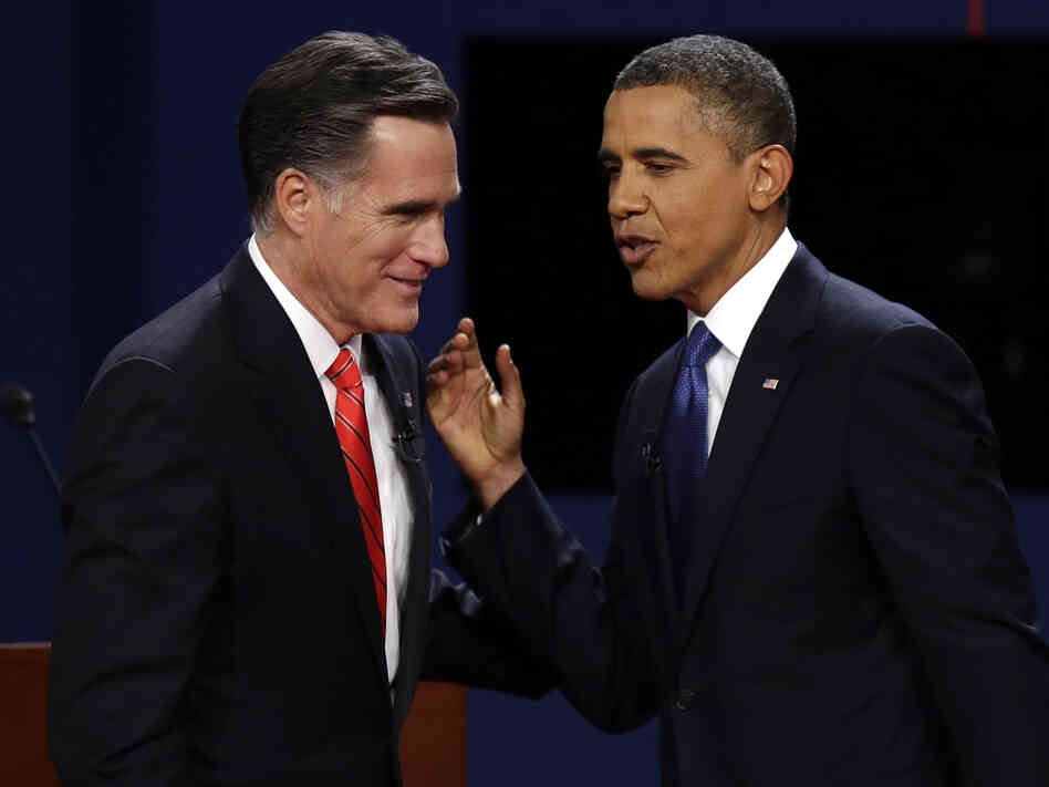 Republican presidential nominee Mitt Romney and President Obama talk after the first presidential debate at the University of Denver on Wednesday.