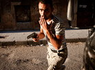 A Free Syrian Army fighter in the Bustan Pasha neighborhood of Aleppo, Syria, Aug. 21. A Free Syrian Army fighter in the Bustan Pasha neighborhood of Aleppo, Syria, Aug. 21.