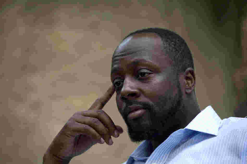 In this Aug. 18, 2010 file photo, Haiti's presidential candidate and hip hop singer Wyclef Jean, speaks during an interview at his mother's house in Croix de Bouquets, Haiti. (AP Photo/Ramon Espinosa, file)