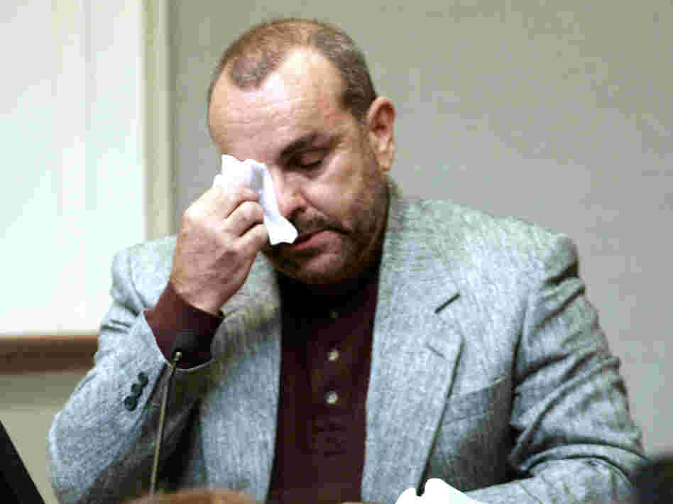 Paul LaRuffa wipes his eyes during John Allen Muhammad's Virginia trial as he describes being shot on Sept. 5, 2002. LaRuffa was shot five times by Muhammad's accomplice, 17-year-old Lee Boyd Malvo.