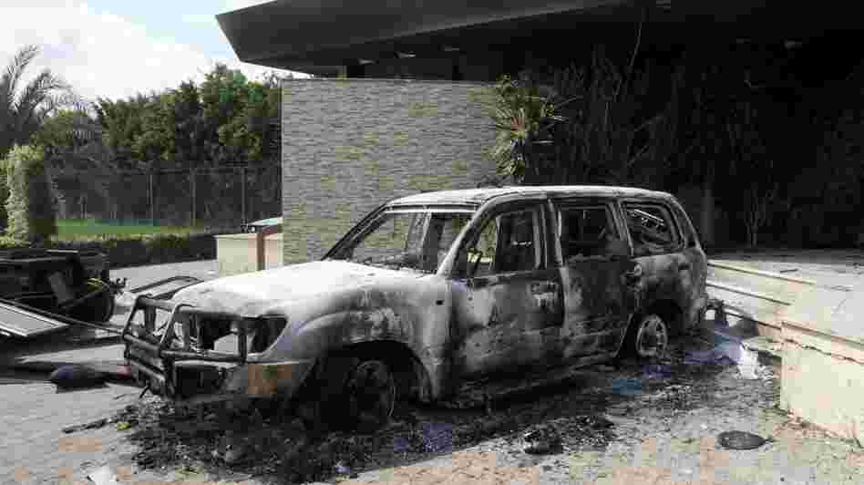 U.S. authorities are investigating whether al-Qaida played a role in last month's attack on the U.S. Consulate in Benghazi. Here, a damaged vehicle sits outside the consulate one day after the attack. U.S. authorities are investigating whether al-Qaida played a role in last month's attack on the U.S. Consulate in Benghazi. Here, a damaged vehicle sits outside the consulate one day after the attack.