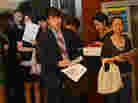 Unemployed Chinese graduates attend a career fair.