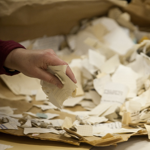 A worker in the former headquarters of the Stasi sorts hundreds of thousands of torn or shredded Stasi documents in January. Workers are sifting through thousands of bags, containing between 50,000 and 80,000 fragments each.
