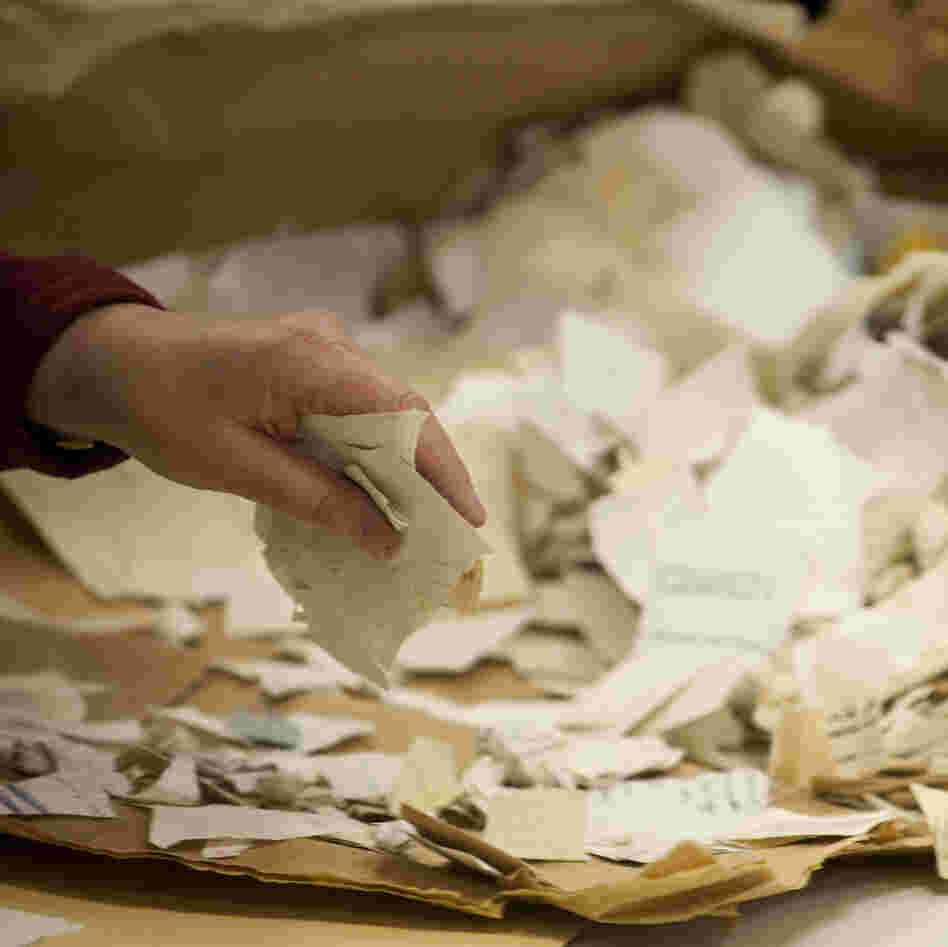 A worker in the former headquarters of the Stasi sorts hundreds of thousands of torn or shredded Stasi documents in January. Workers are sifting through thousands of bags, containing between 50,000 and 80,000 fragments each.